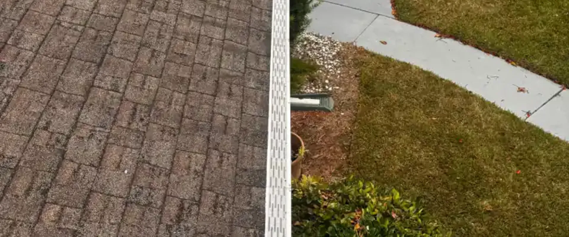 New white seamless gutters installed along a shingle roofline at a St. Petersburg home